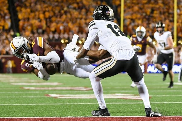 Koi Perich’s interception return lifts Minnesota over Purdue 27-20