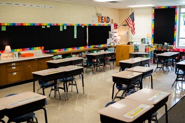 Desks in a classroom at Kennedy Elementary are set up in a way that students will be socially distand when they come back to class in Hastings, Minn., on Tuesday, Sept. 1, 2020. Each pair of desks has an "A" and a "B" seat that a student will sit in depending on what day they come to school.