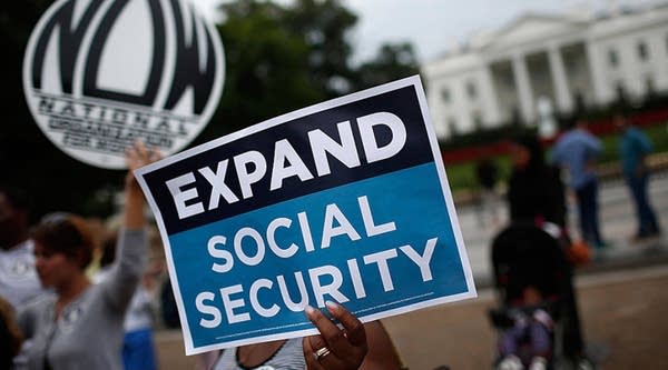 Activists participate in a rally urging the expansion of Social Security benefits in front of the White House July 13, 2015 in Washington, DC.