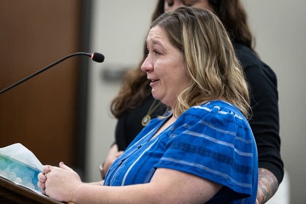 A woman cries on the stand