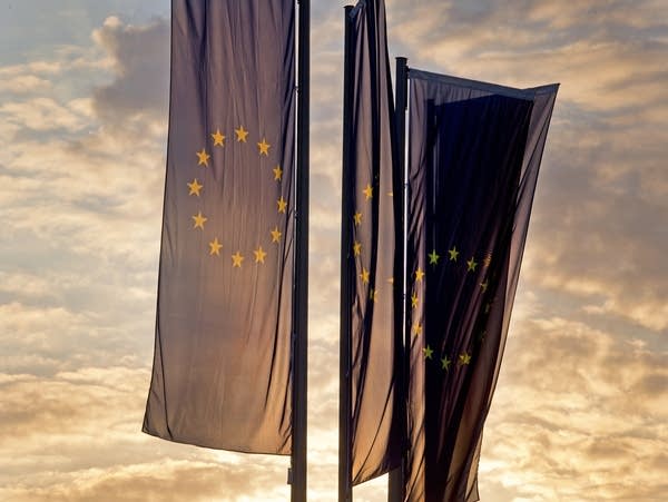 European flags blow in front of the European Central Bank