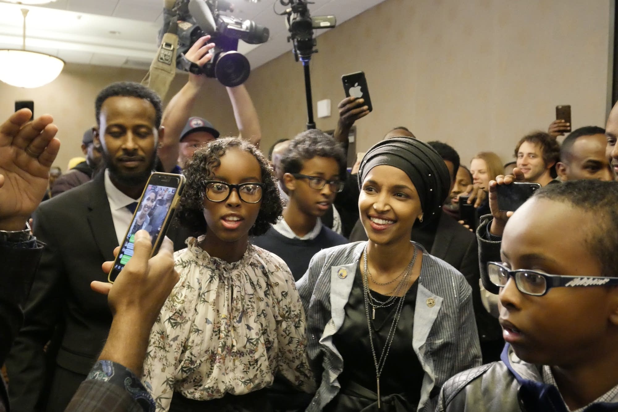 Ilhan Omar and her family enter her victory party.