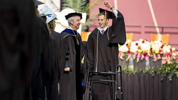 Paralyzed teen walks at commencement