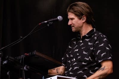 Jake Clemons' keyboardist performing on stage