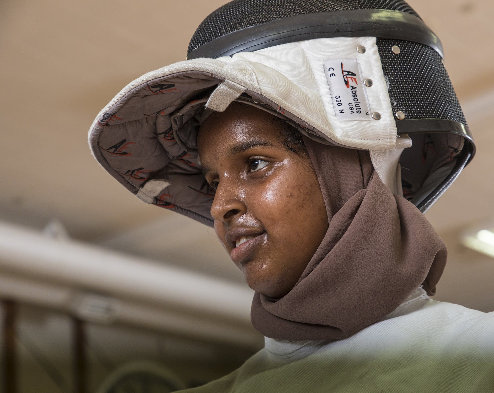 Amina Ahmed watches others fencing in class.