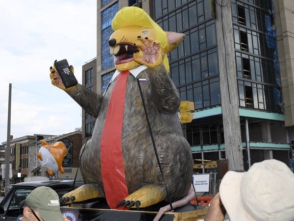 An giant inflatable rat depicting President Trump.