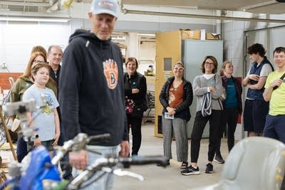 People learning about how bike trails are painted