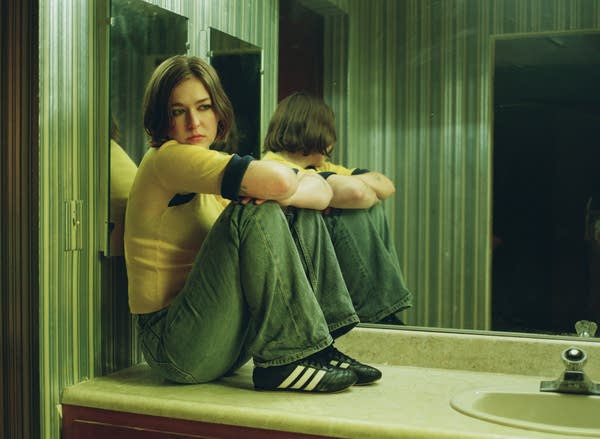 Snail Mail sits on a bathroom counter.