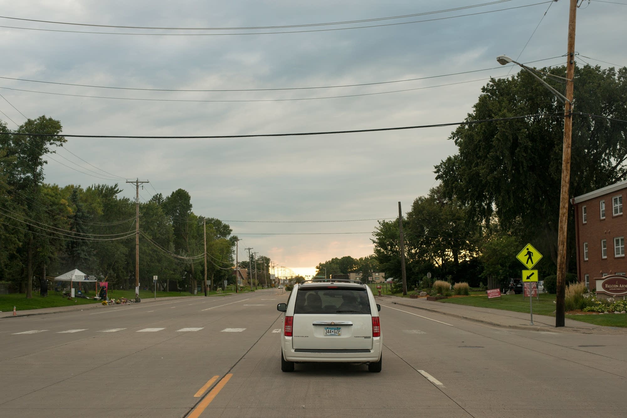 The group drives by the memorial to Castile.