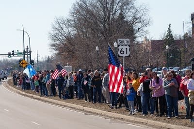 People watch a procession 