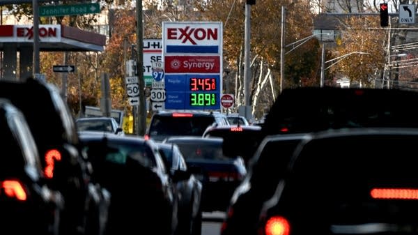 The price of gas is seen as traffic moves through Annapolis, MD, on November 23, 2021. - With inflation surging ahead of the Thanksgiving holiday, US President Joe Biden has drawn on the seldom-used Strategic Petroleum Reserve to combat rising oil prices that have fueled the recent spike.