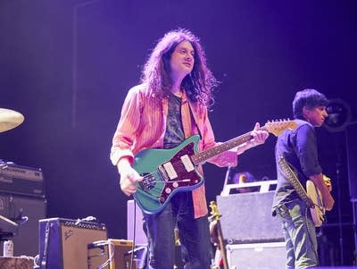 Kurt Vile and the Violators perform onstage.