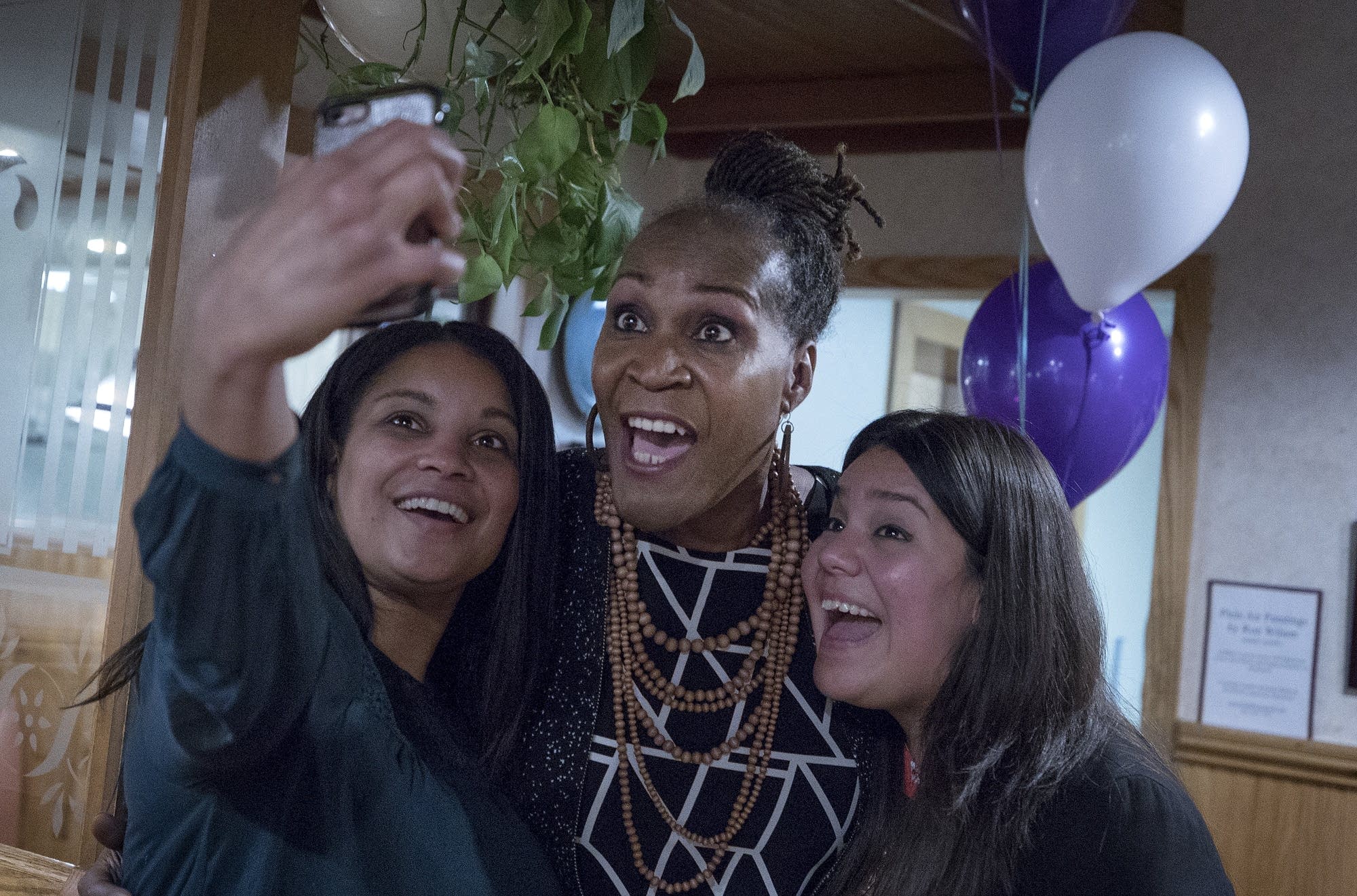Deebaa Sirdar and Sara Lopez take a selfie with Andrea Jenkins
