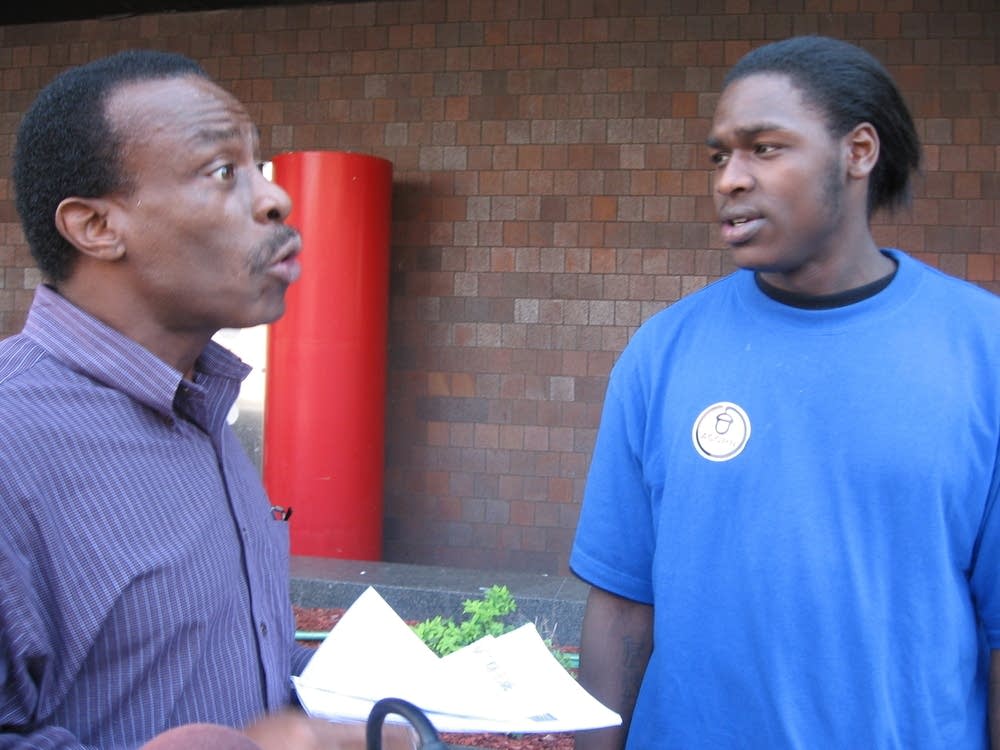 Tyrone Spann talks to voter Steve Burston