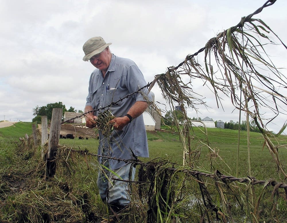 Dennis Tweet fixes fences damaged by storms.