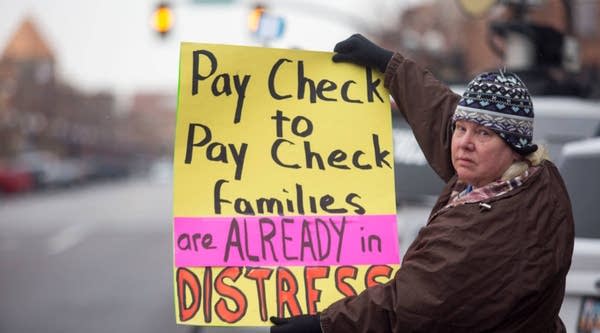 Social worker Pam Harrison holds a sign protesting the government shutdown at the James V. Hansen Federal Building on January 10, 2019 in Ogden, Utah.
