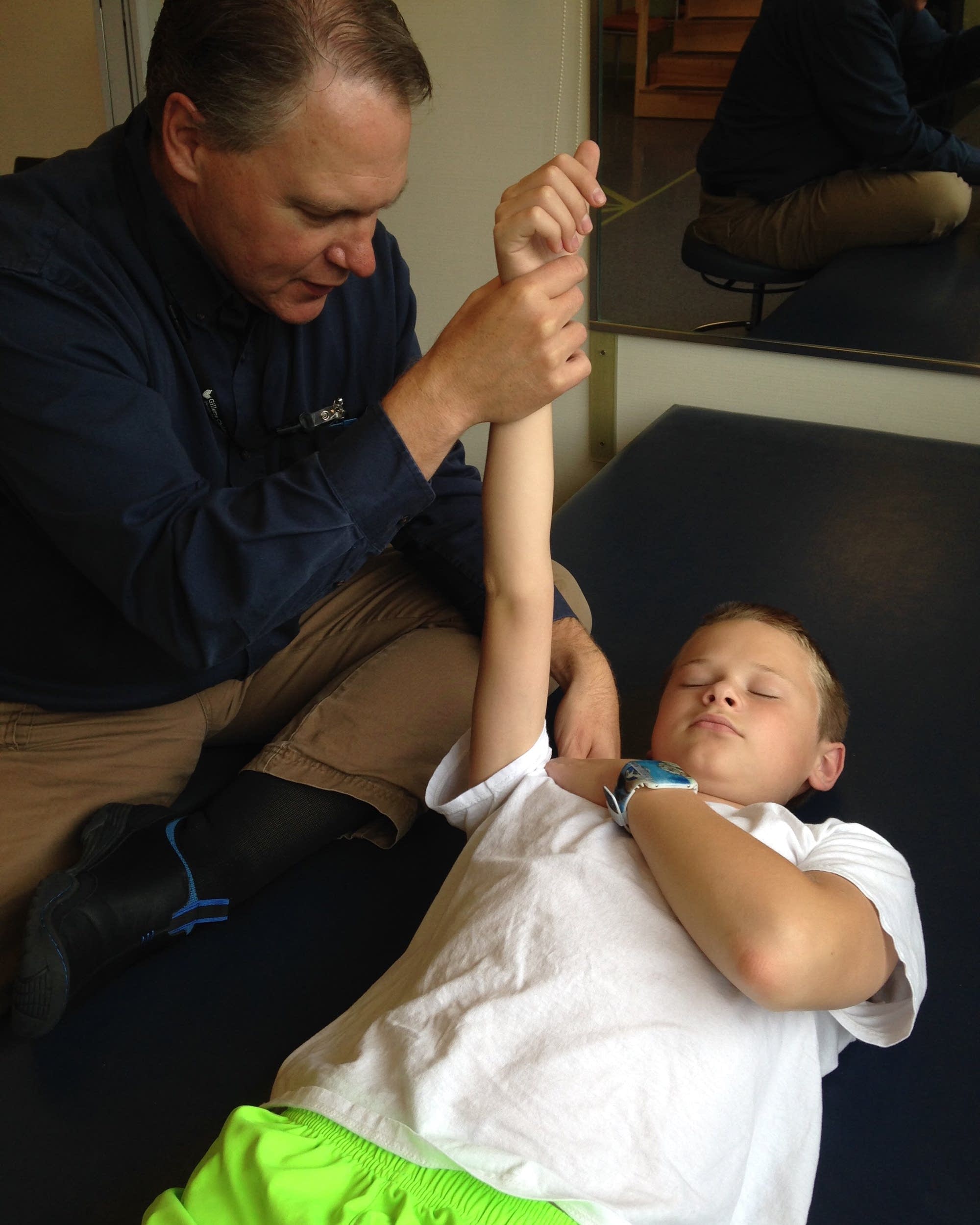 Craig Swanson undergoes physical therapy in October 2014.