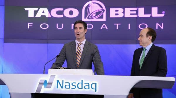 CEO of Taco Bell Corp. Brian Niccol and CEO and President of Viacom Philippe Dauman ring the NASDAQ Opening Bell.