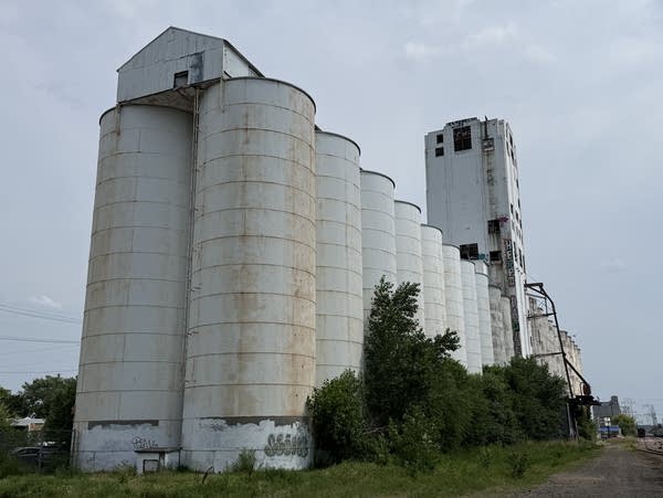 An abandoned concrete grain elevator and silos