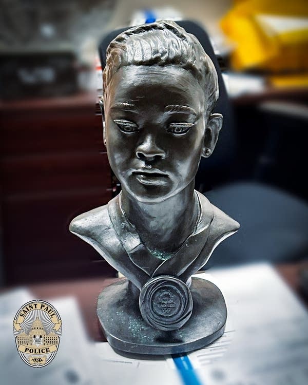 A bronze bust of an Olympic gymnast