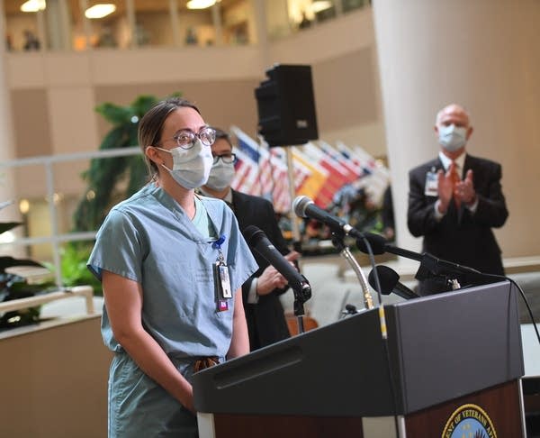 Thera Witte, RN, speaks during a press conference.