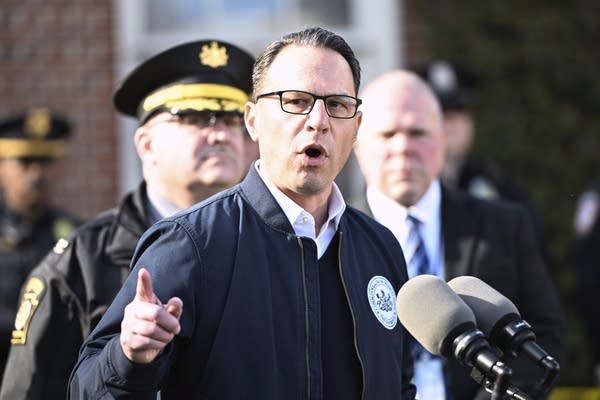 a man speaks at a press conference