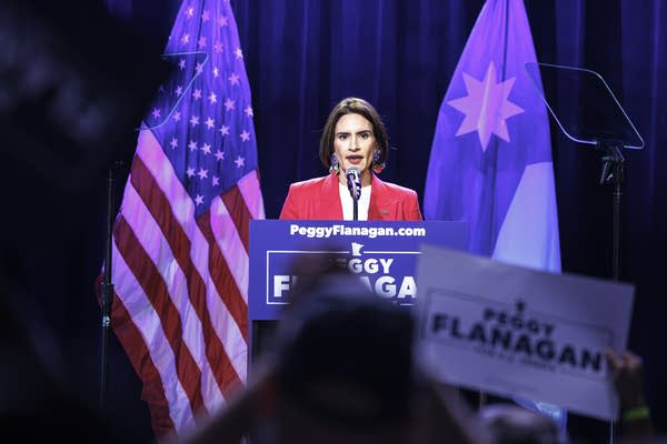 A woman talks at a podium-1