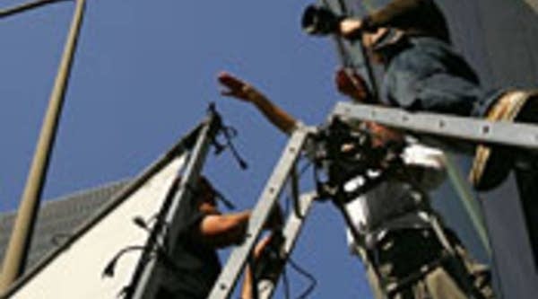 Crew members set up a camera for the shoot in Los Angeles