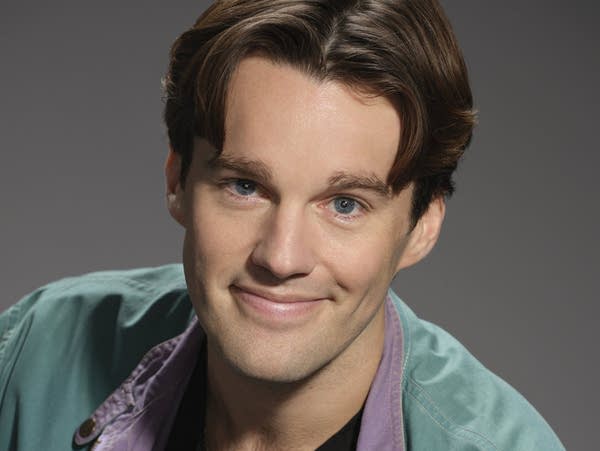 An actor poses for a studio portrait