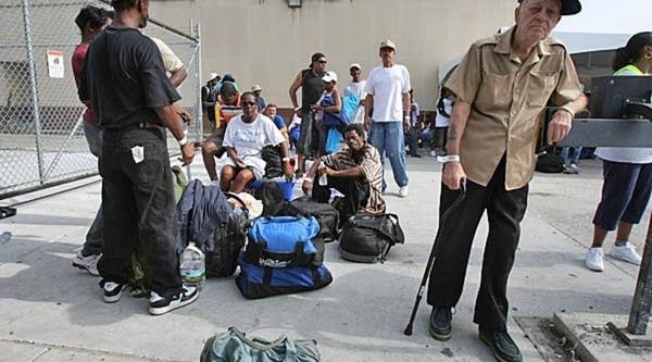 New Orleans residents wait for buses and trains to evacuate them from the city at the Union Passenger Terminal in New Orleans on Sunday.