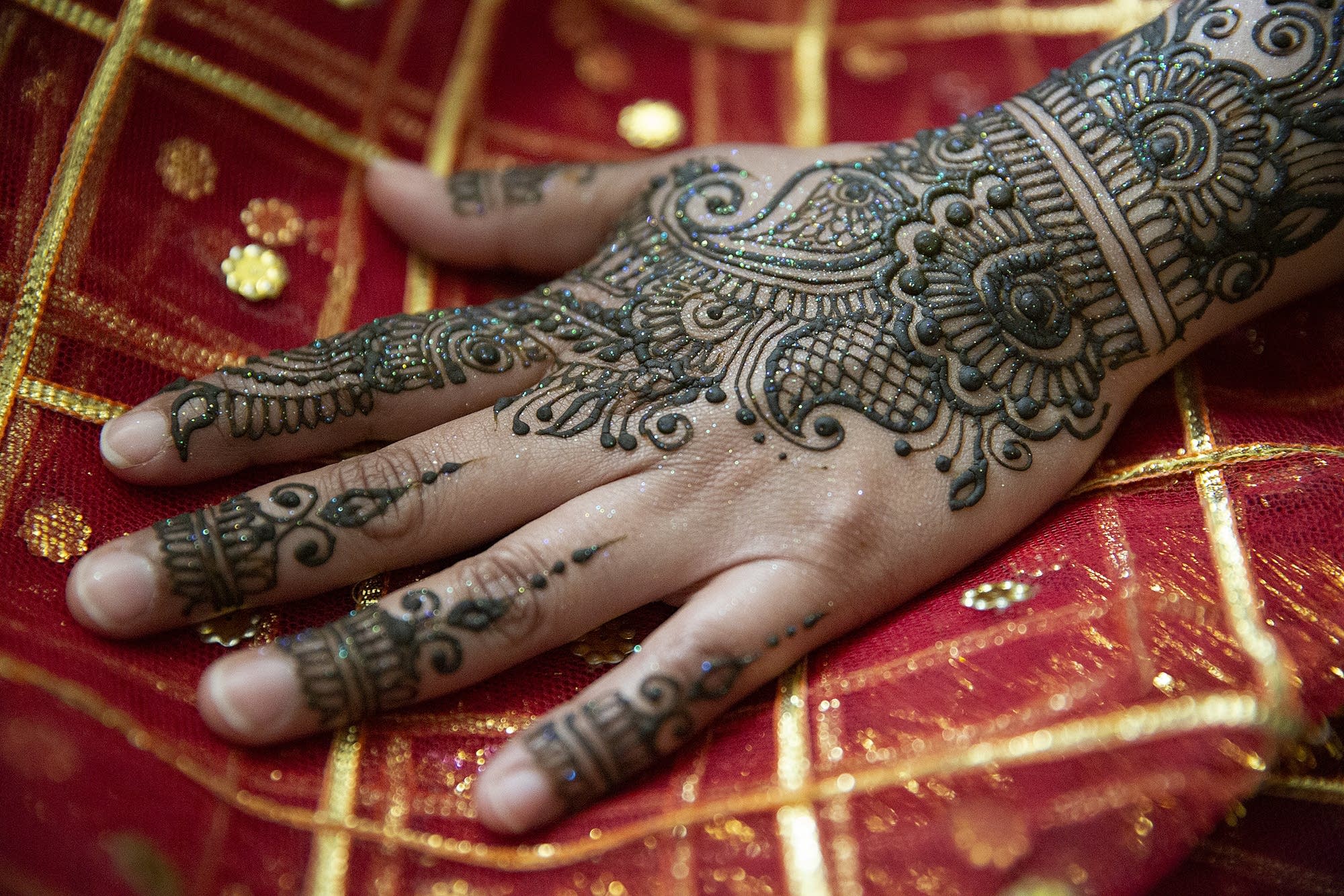 Henna paste dries on Fahmidha Ameen's hand.