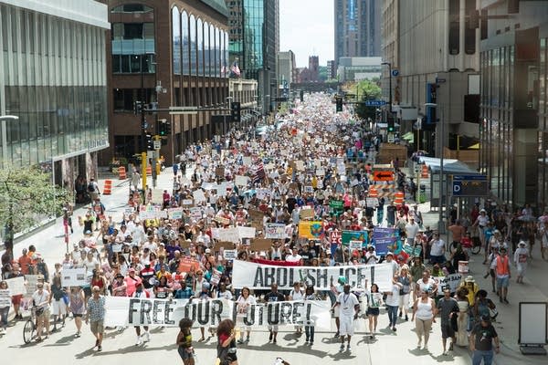 Thousands of protesters make their way down the streets of Minneapolis.