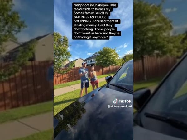 Screen capture of a TikTok video, recorded from behind a car, of a couple arguing with people offscreen.