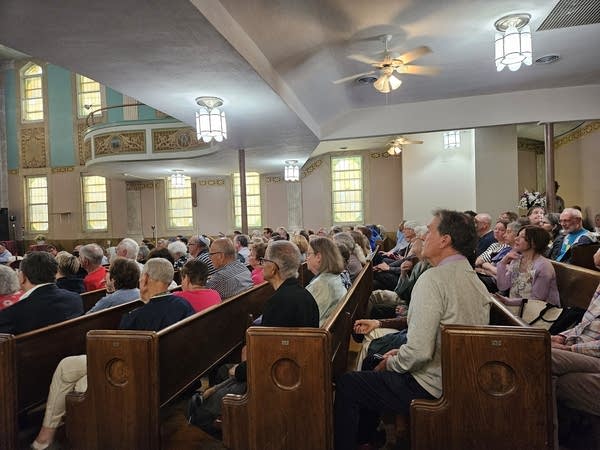 People sit in pews