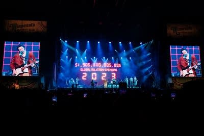 Hozier and band performing on stage