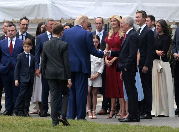 Trump shaking hands with Charles Kushner