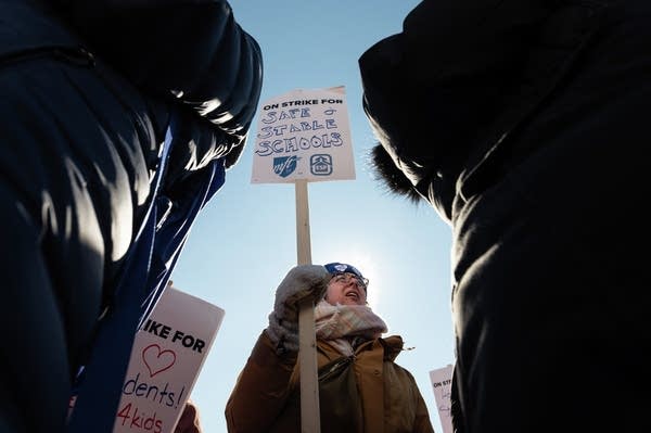 Minneapolis teachers walk out in front of the state Capitol.