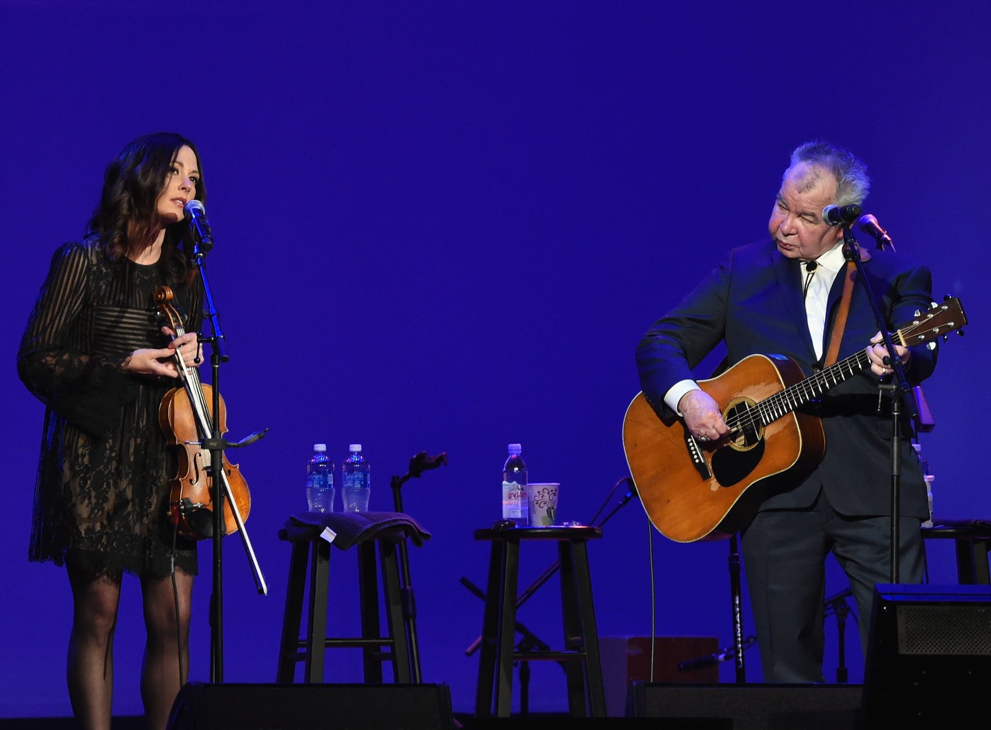 Amanda Shires and John Prine performing onstage in 2017