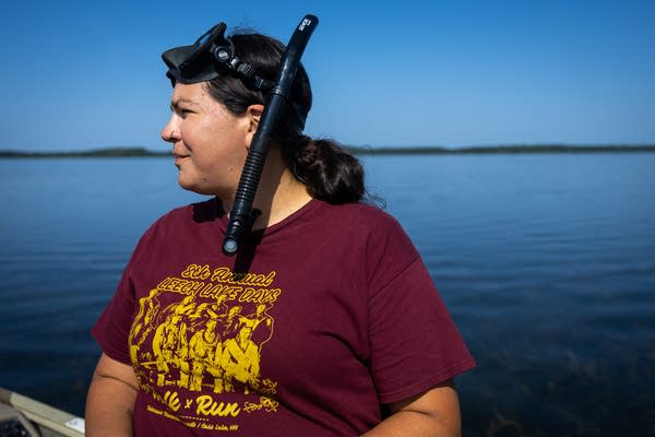 A woman wears a snorkel