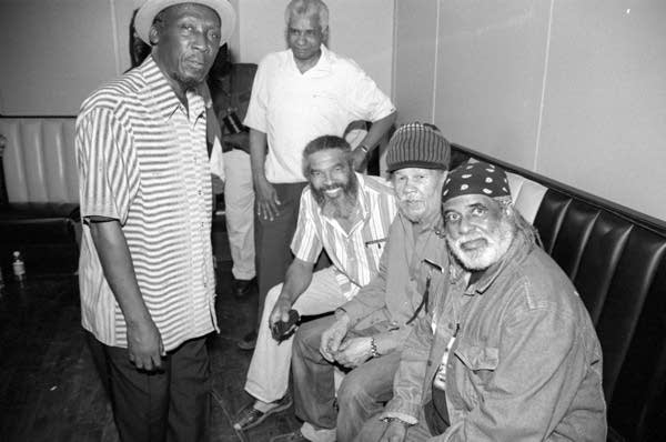 Vintage ska performers chilling out backstage