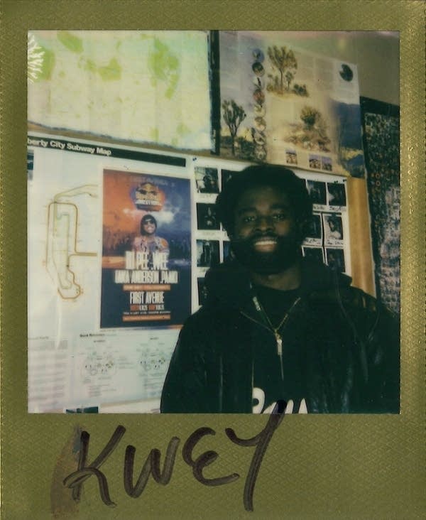 kwey posing for a polaroid photo