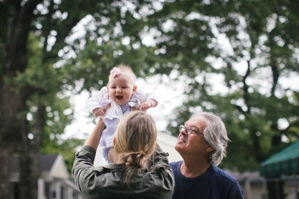 Greg O'Brien and his daughter, Colleen, play with Adeline