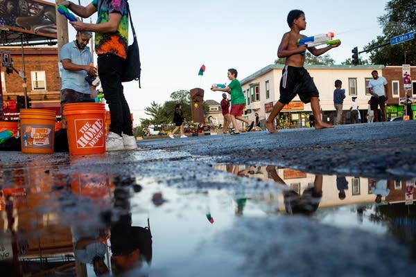 Kids hold water guns