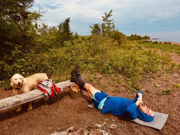 Cam Schaefer and Charlie the dog take a break .