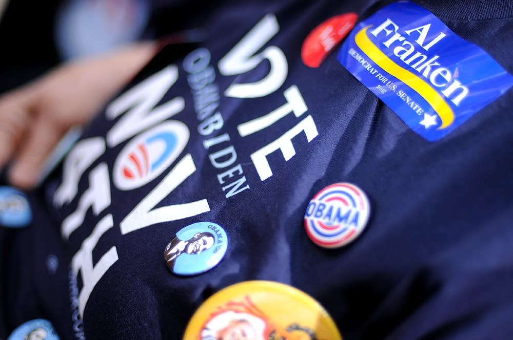 A supporter shows her buttons at the rally