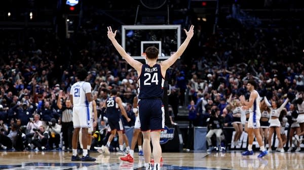 Braylon Mullins of the UConn Huskies celebrates after shooting the game-winning three point basket in the Elite Eight game of the 2026 NCAA Men's Basketball Tournament.