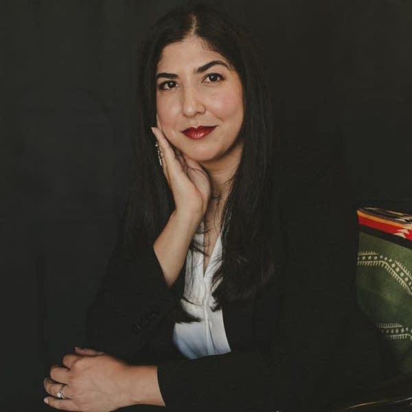 A woman poses for a professional portrait.