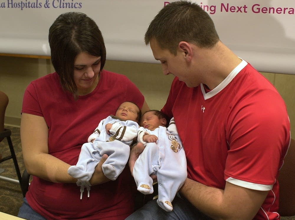 Jeane and Jeff Cassellius hold their new twins