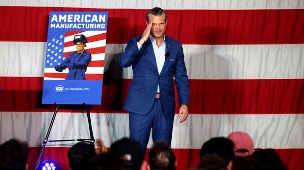 United States Secretary of Defense Pete Hegseth salutes the crowd at the end of his speech to employees with defense/aerospace manufacturing company Rocket Lab in Long Beach on January 9, 2026. The stop was part of Hegseth's nationwide, "Arsenal of Freedom," tour, a call to action to revitalize America's manufacturing and re-energize the nation's workforce. 