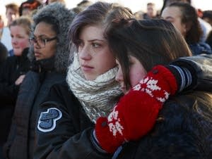 Evelyn Ryan, left, and Jordan Nelson, right, embrace.